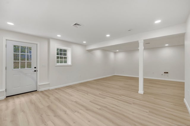 basement featuring light wood-type flooring