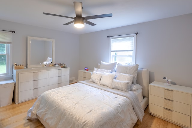 bedroom featuring light hardwood / wood-style floors and ceiling fan