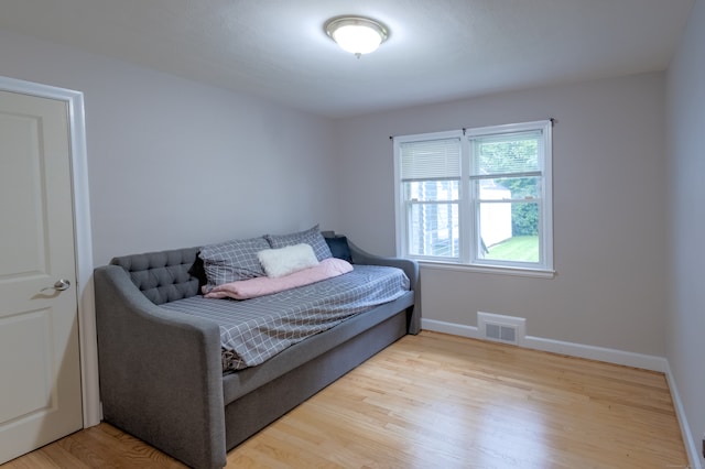 bedroom with light wood-type flooring