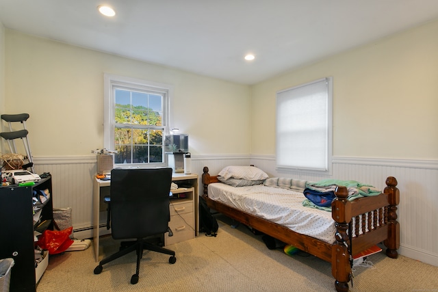 carpeted bedroom featuring a baseboard radiator