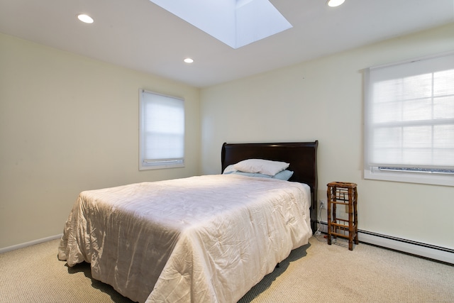 carpeted bedroom featuring a skylight