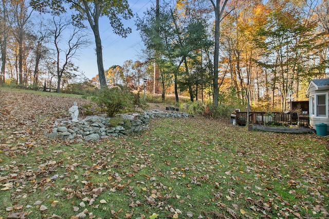 view of yard with a wooden deck