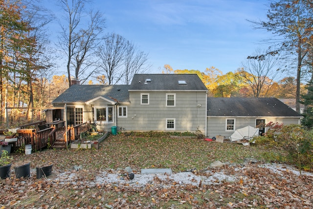 back of property featuring a wooden deck