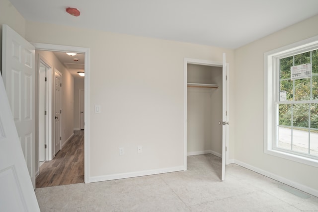 unfurnished bedroom featuring light wood-type flooring