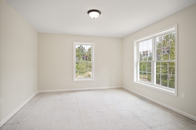 unfurnished room with a healthy amount of sunlight