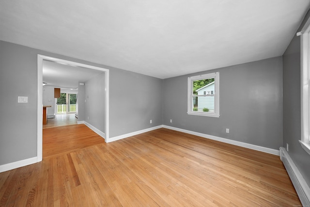 251 Stevens St, Bristol, CT 06010 - empty room featuring baseboard heating and light wood-style flooring