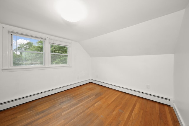 251 Stevens St, Bristol, CT 06010 - bonus room featuring a baseboard heating unit, lofted ceiling, and wood finished floors