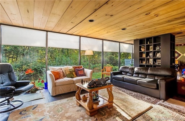 living room with built in shelves, wooden ceiling, and floor to ceiling windows