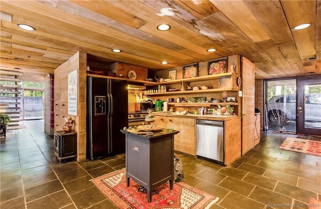 kitchen featuring stainless steel appliances, plenty of natural light, wood ceiling, and a center island