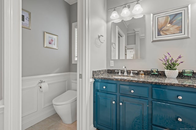 bathroom featuring tile patterned floors, vanity, and toilet