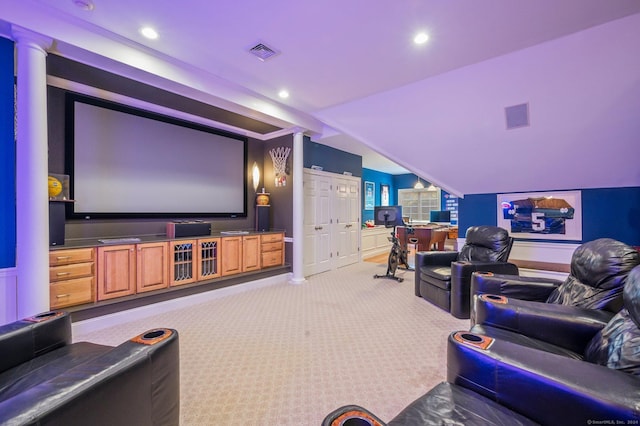 home theater with lofted ceiling and light carpet