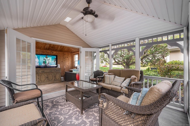 sunroom with lofted ceiling and ceiling fan