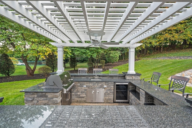 view of patio / terrace with wine cooler, an outdoor kitchen, a grill, and a pergola