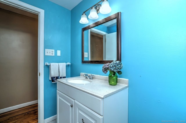 bathroom featuring wood-type flooring and vanity