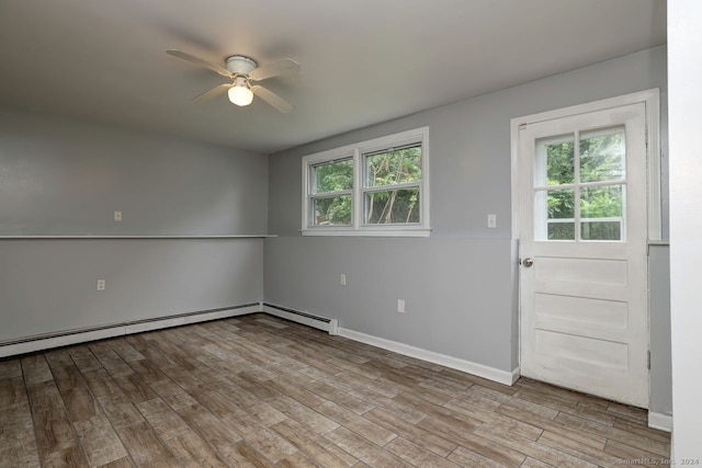 interior space featuring ceiling fan, a baseboard radiator, and light hardwood / wood-style flooring