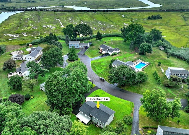 bird's eye view with a water view and a rural view