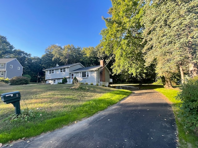 view of front of home with a front lawn