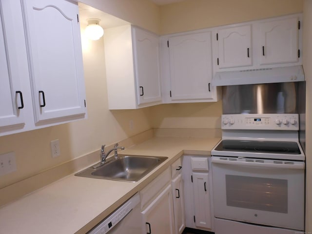 kitchen featuring sink, white appliances, and white cabinets