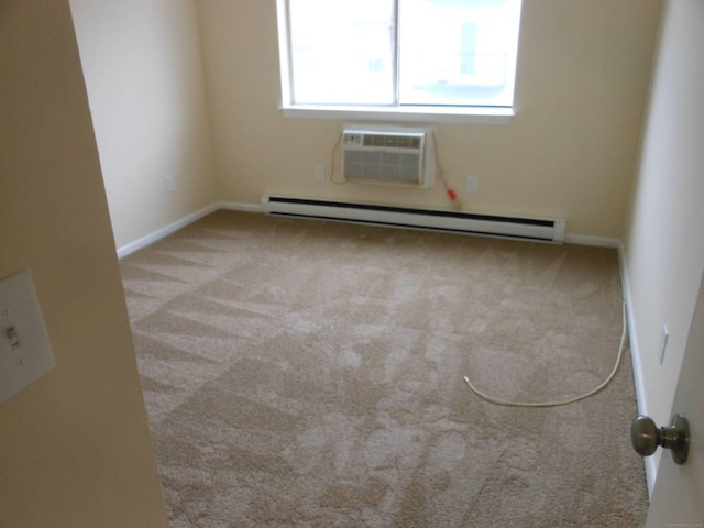 spare room with light carpet, a baseboard heating unit, and a wall mounted AC