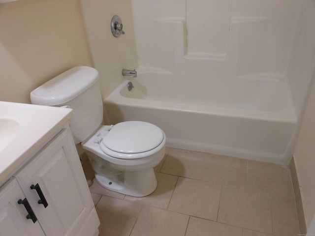 bathroom featuring tile patterned floors, vanity, and toilet