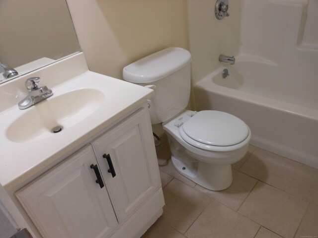 full bathroom with tile patterned flooring, vanity, shower / tub combination, and toilet