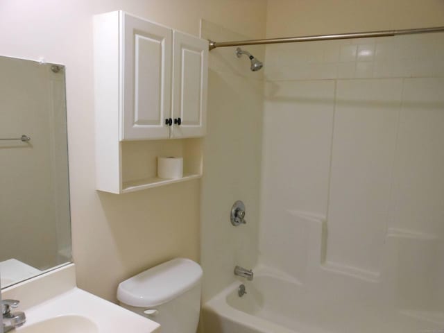 full bathroom featuring shower / bathing tub combination, vanity, and toilet