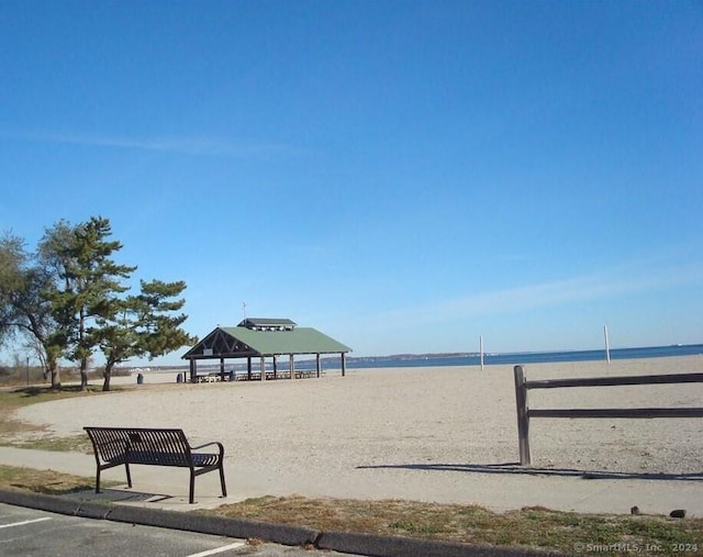 view of community with a gazebo and a water view