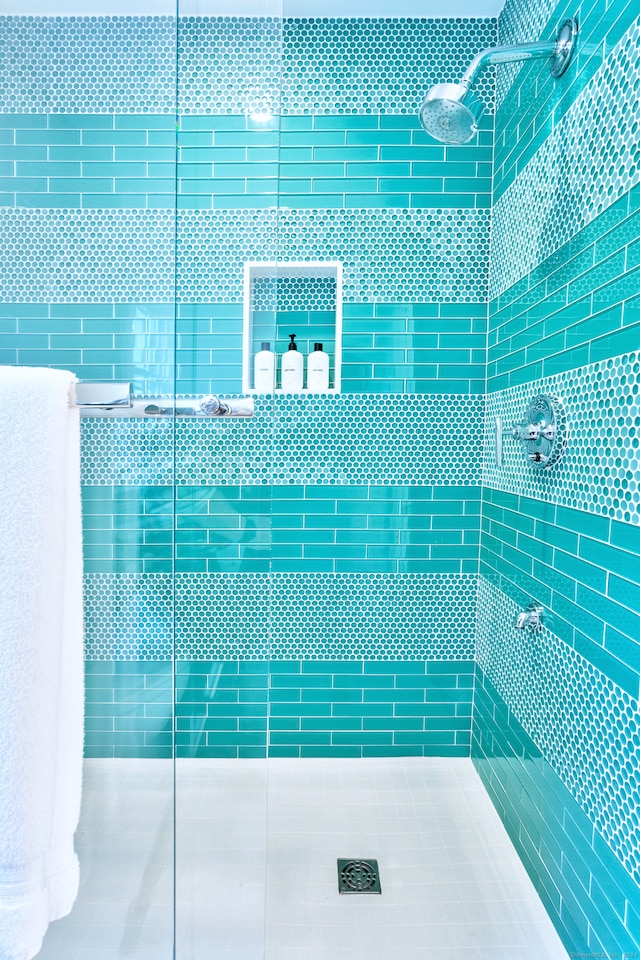 exterior space with tiled shower and tile patterned floors