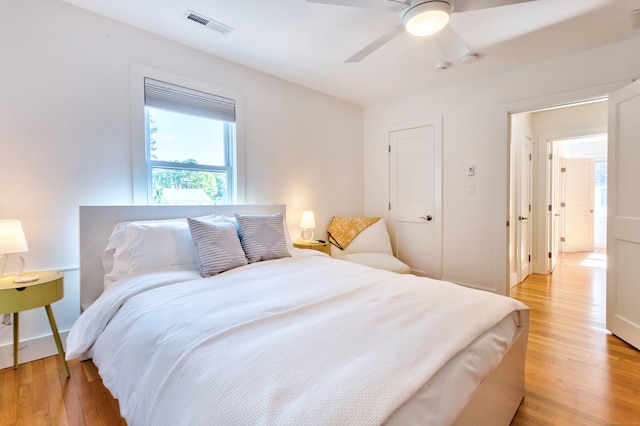 bedroom featuring light wood-type flooring and ceiling fan