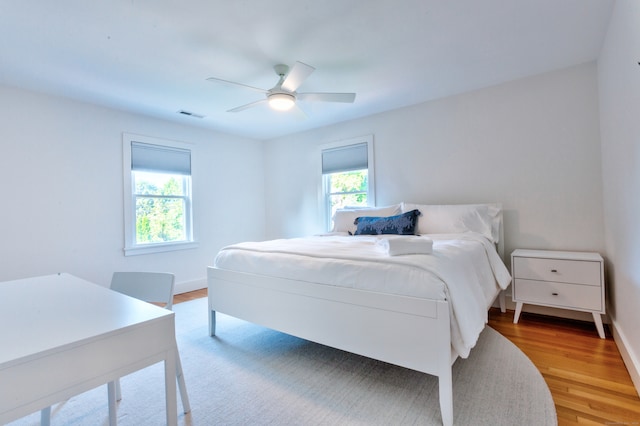 bedroom featuring wood-type flooring and ceiling fan