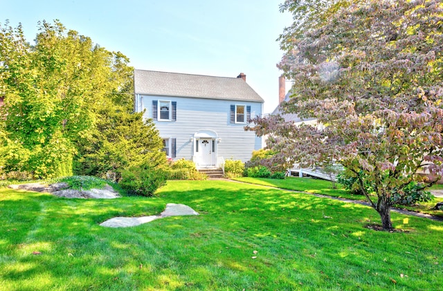82 Thimble Island Rd, Branford, CT 06405 - back of property with a chimney and a yard