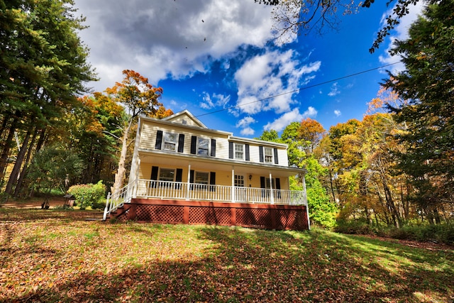 view of front of home with a front lawn and covered porch