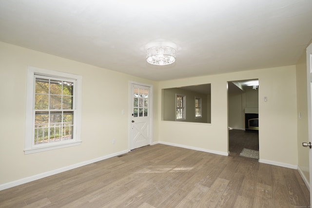 spare room with light wood-type flooring