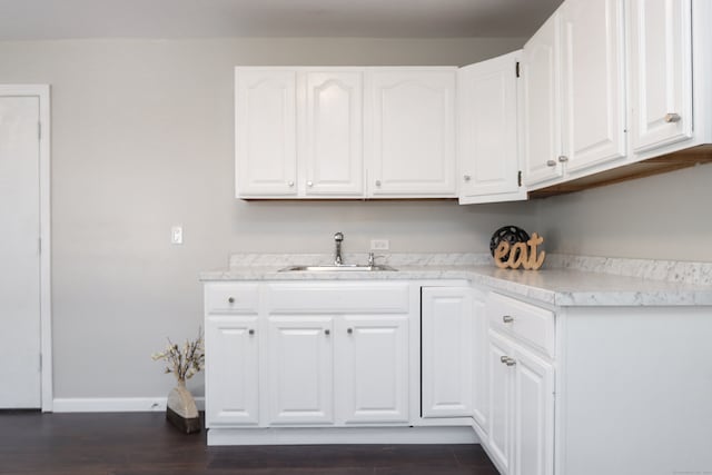 kitchen featuring white cabinets, sink, and dark hardwood / wood-style flooring