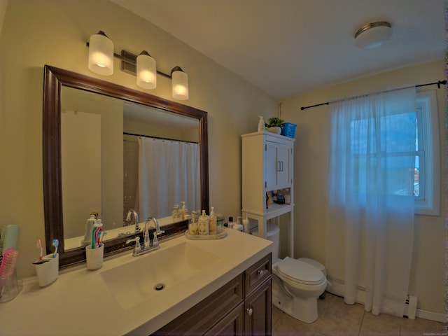 bathroom with tile patterned floors, vanity, and toilet