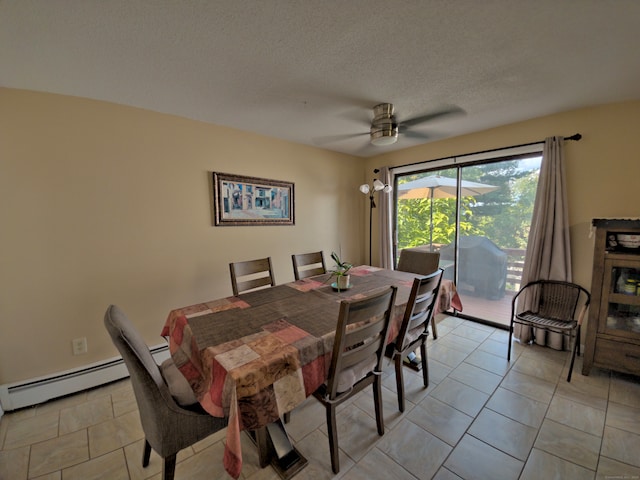 tiled dining space featuring ceiling fan, baseboard heating, and a textured ceiling