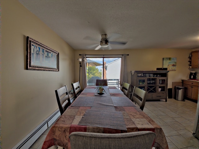 dining room featuring ceiling fan, a baseboard radiator, and a textured ceiling