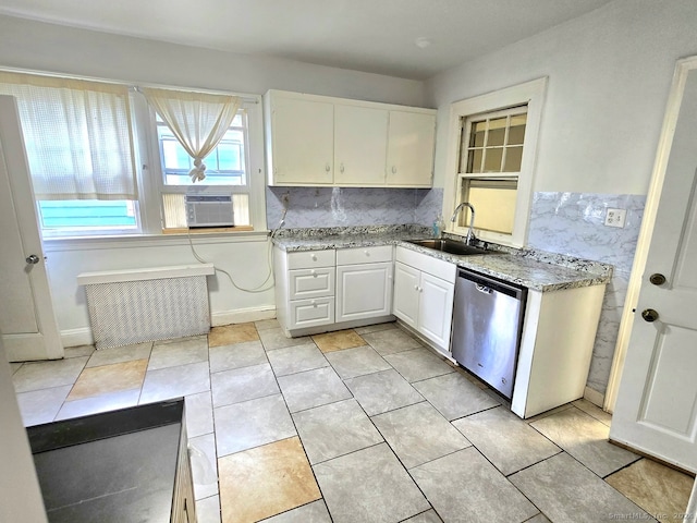 kitchen with dishwasher, tasteful backsplash, sink, cooling unit, and white cabinetry