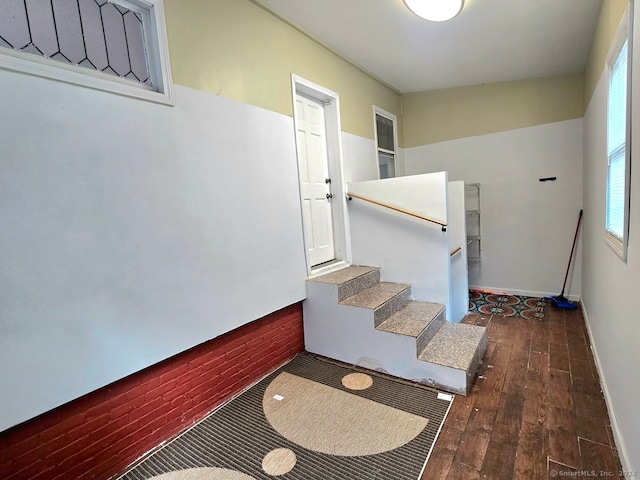 stairway featuring hardwood / wood-style floors