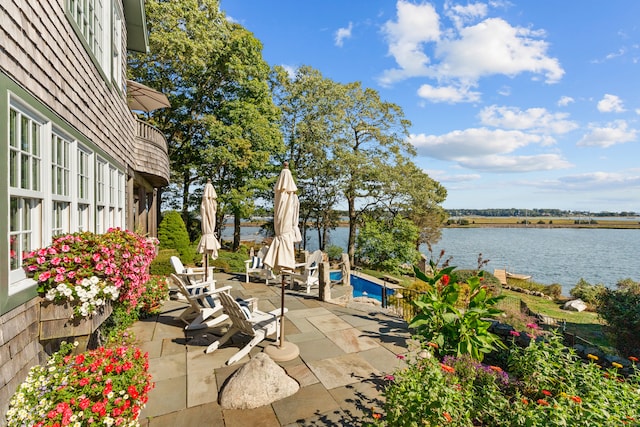 view of patio featuring a water view