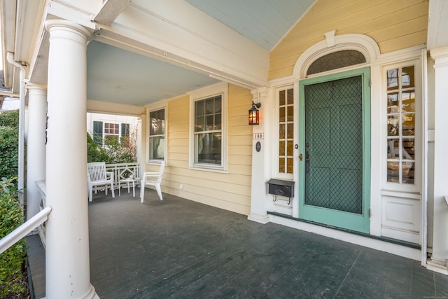 doorway to property featuring covered porch