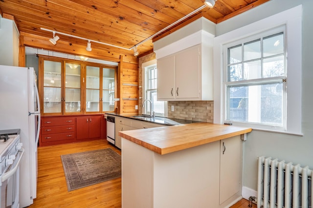 kitchen with radiator, white cabinetry, wooden ceiling, kitchen peninsula, and white appliances