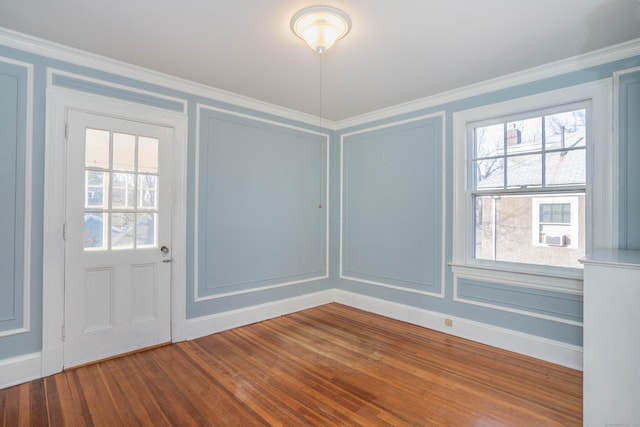 interior space featuring crown molding and hardwood / wood-style floors