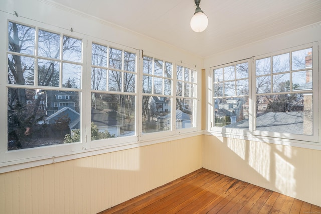 unfurnished sunroom with plenty of natural light