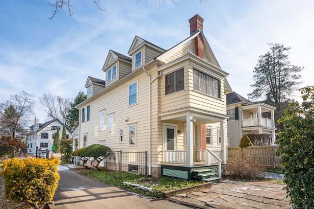 view of side of home featuring a porch