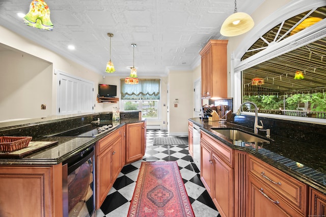 kitchen with pendant lighting, black electric stovetop, dark stone counters, sink, and beverage cooler