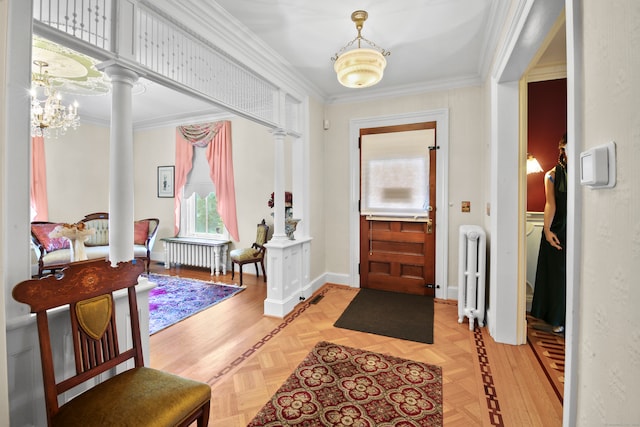 entryway with crown molding, radiator heating unit, and light parquet flooring