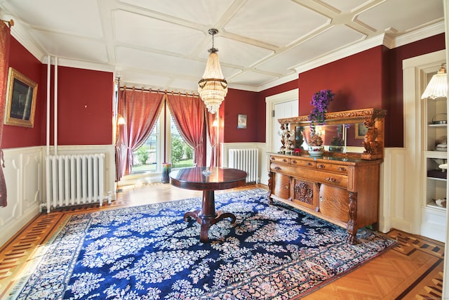 sitting room with coffered ceiling, crown molding, and radiator heating unit