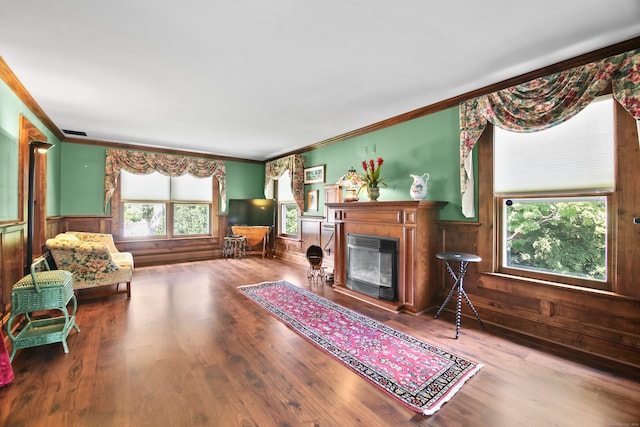 living room featuring ornamental molding and hardwood / wood-style flooring