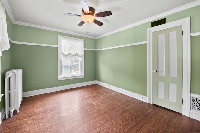 unfurnished bedroom featuring ceiling fan, radiator, hardwood / wood-style flooring, and crown molding